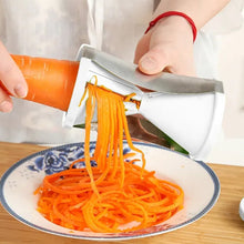 Handheld spiralizer peeler for creating spirals of vegetables and fruits.