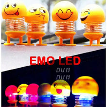 Dancing emoji dashboard doll with LED light.