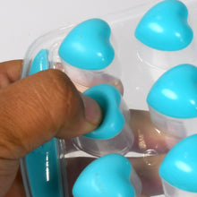 Ice tray with heart-shaped compartments