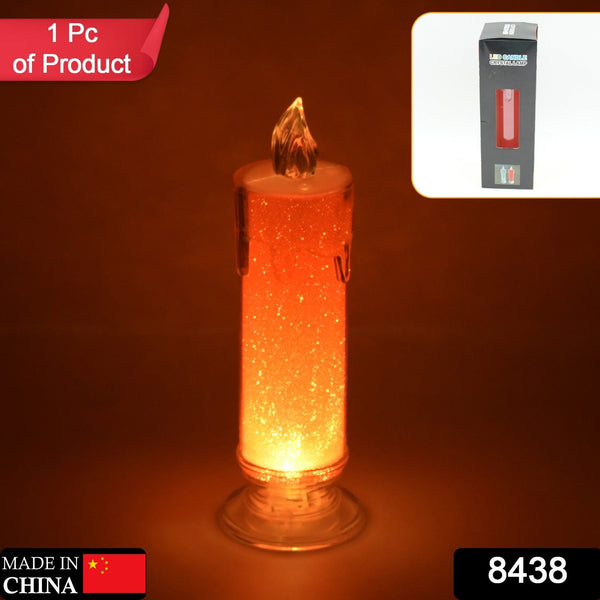 Close-up of red flameless candle, showcasing its transparent design and decorative flame effect.