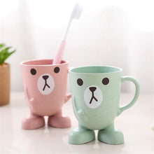 Toothbrush holder with cup and handle, designed for kids' oral care and convenience.